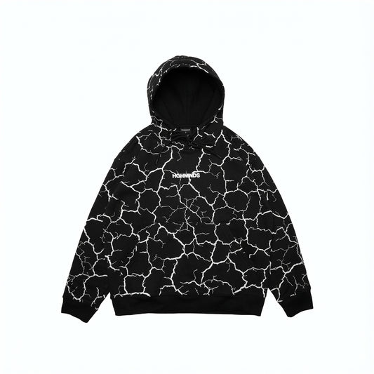 Black hoodie and sweatpants with white cracked earth pattern.