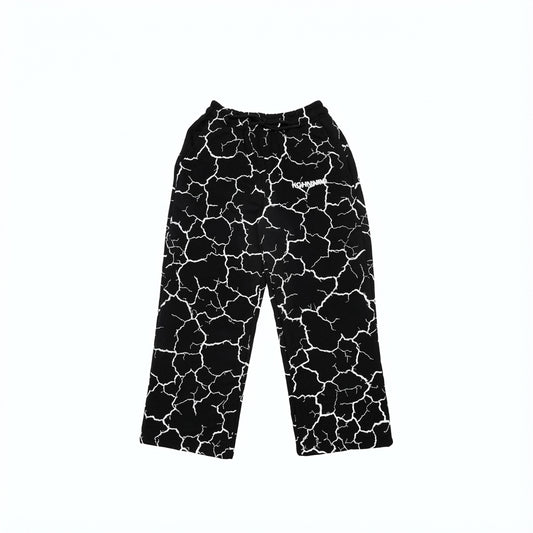 Black drawstring pants with white lightning bolt print and logo.