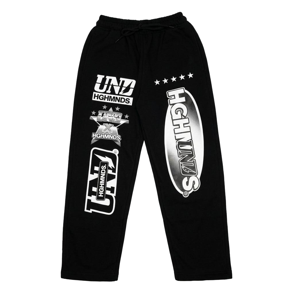Black minimalist street-style joggers with various white graphic prints including "UND," "HGHMNDS," and stars, reflecting Suray's aesthetic.